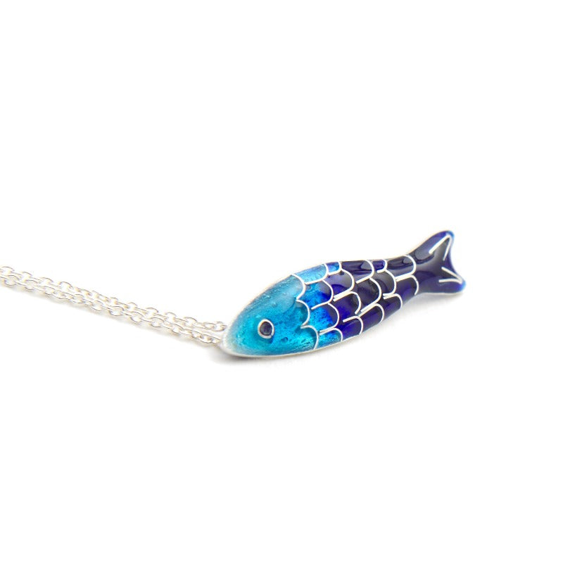 Small glass enamel cloisonné fish, applied on fine silver, accompanied by a delicate 45 cm sterling silver chain with an additional 5 cm for size adjustment. Light blue and dark bluefish.