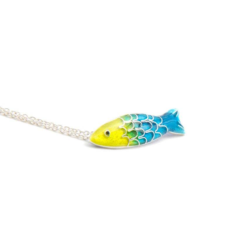 Small glass enamel cloisonné fish, applied on fine silver, accompanied by a delicate 45 cm sterling silver chain with an additional 5 cm for size adjustment. Light blue and yellow fish.