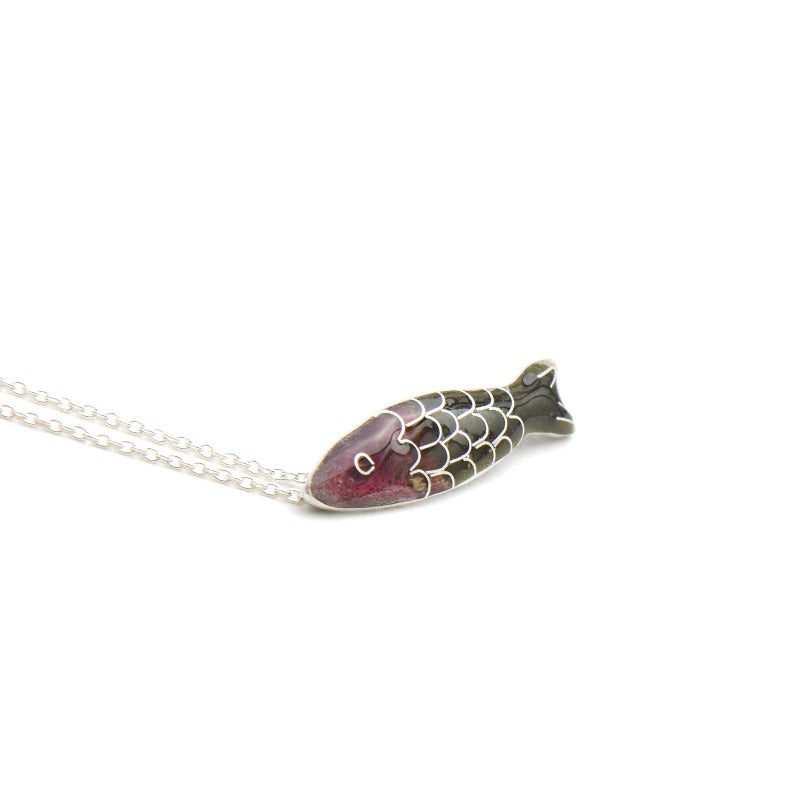 Small glass enamel cloisonné fish, applied on fine silver, accompanied by a delicate 45 cm sterling silver chain with an additional 5 cm for size adjustment. Dark violet and brown-green fish.