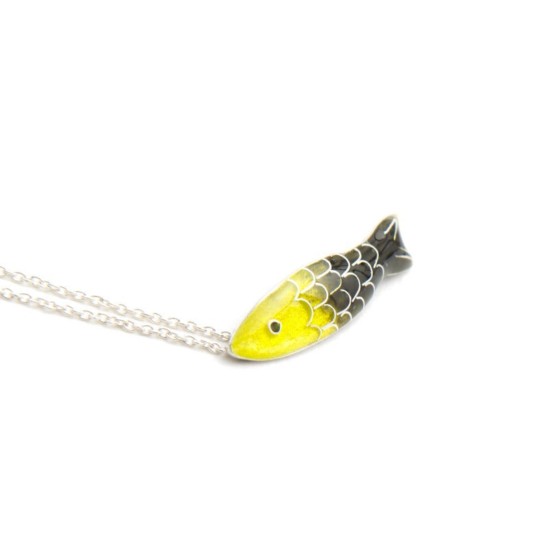 Small glass enamel cloisonné fish, applied on fine silver, accompanied by a delicate 45 cm sterling silver chain with an additional 5 cm for size adjustment. Yellow and brown-green fish.