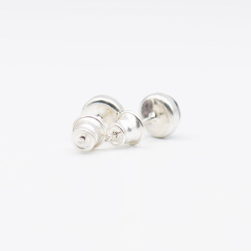 Medium round cabochon studs in sterling silver and glass, featuring a delicate painting of a climbing plant.