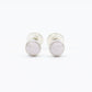 Small round cabochon studs in sterling silver and glass, featuring a tiny upcycled round glass. Light pink glass