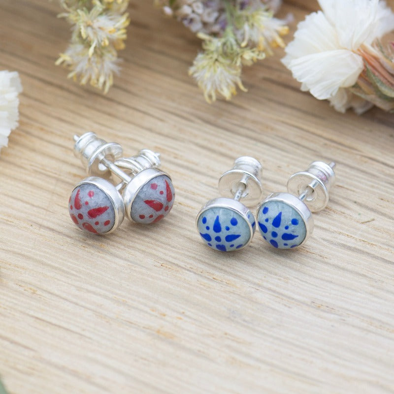 Medium round cabochon studs in sterling silver and glass, featuring a delicate painting of a stylized star. 