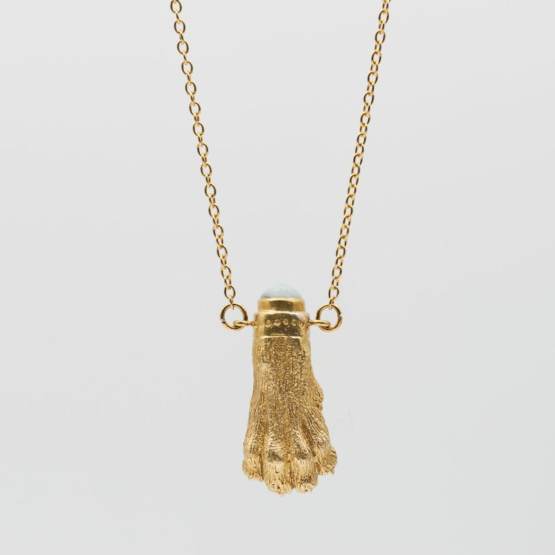 Realistic lion paw sculpture crafted in 18k gold-plated brass, featuring a small upcycled glass set on top. Evokes an ancient Roman jewelry vibe, complemented by a delicate stainless steel chain